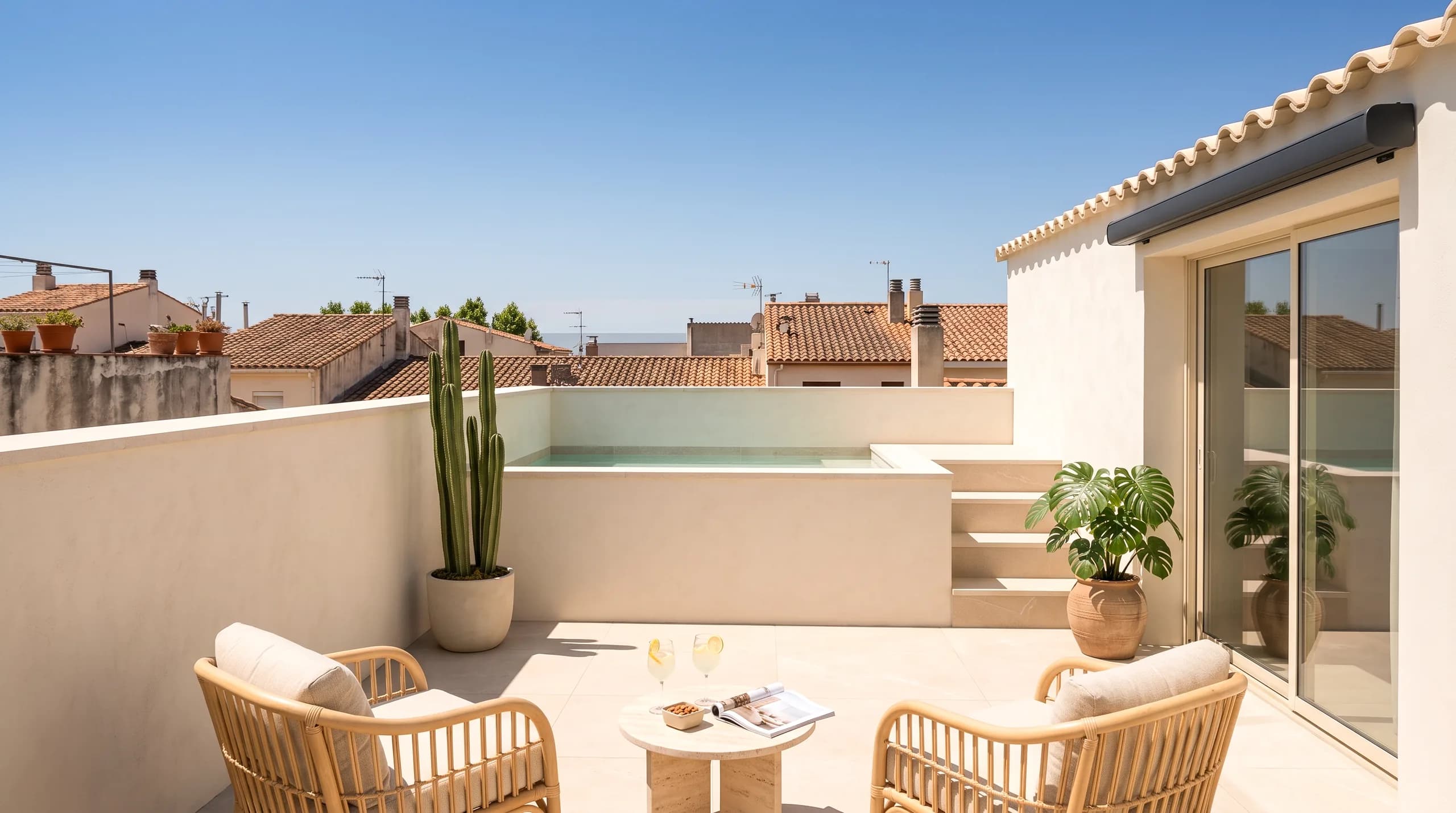 The same terrace rendered, with the village rooftops and the sea behind